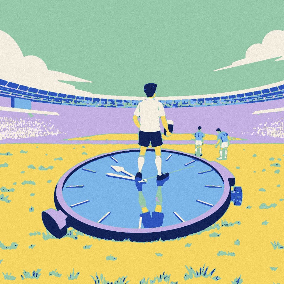 A tiny supporter holding a pint stands on an enormous wristwatch outside a stadium while two distant players stretch for a ball.