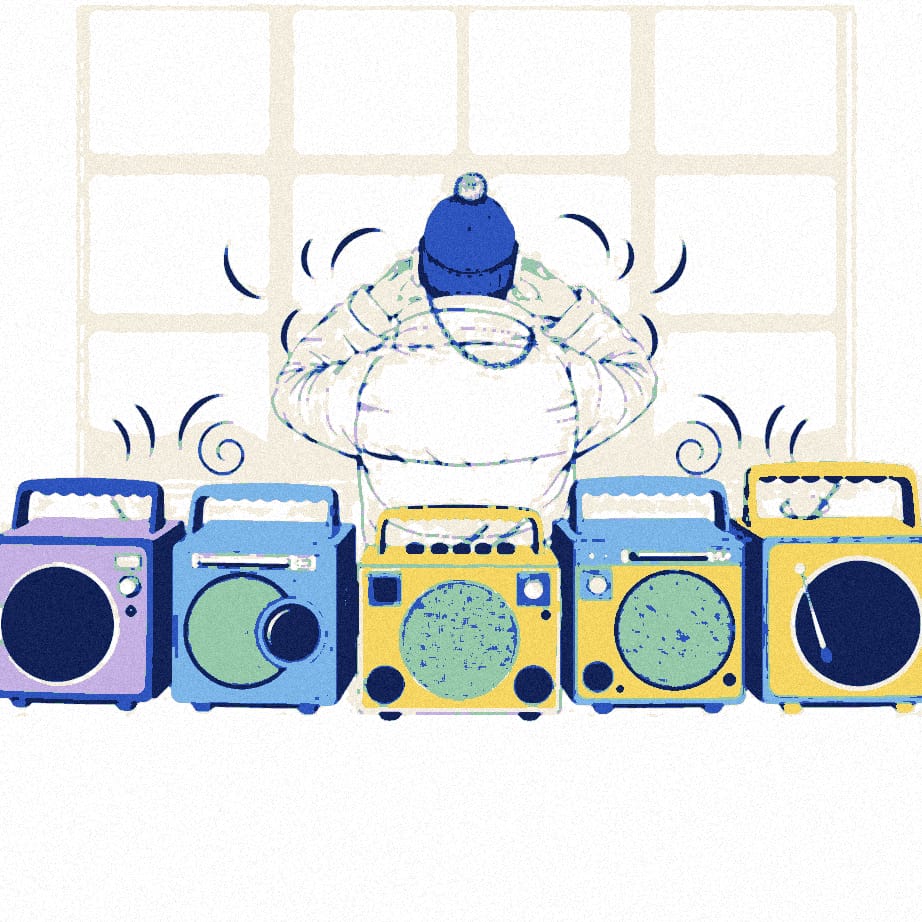 Five radios of increasing size on a kitchen table, the largest blaring and rattling crockery, while a figure in a padded jacket and beanie covers their ears.