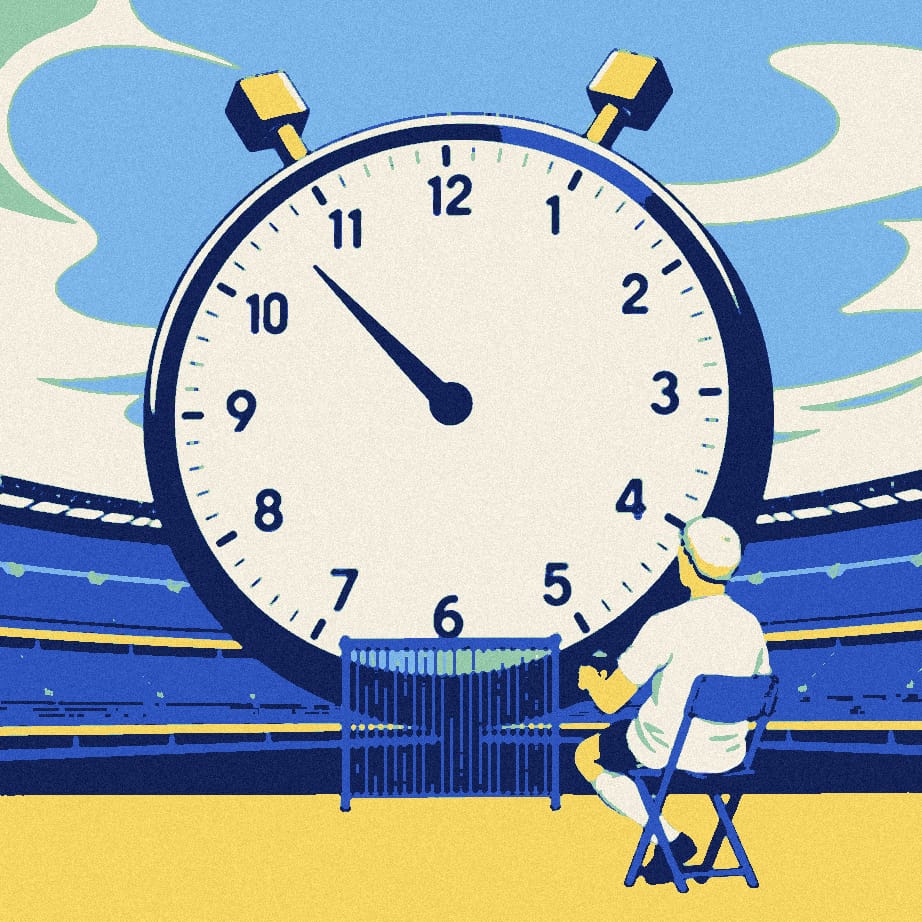 A tiny supporter in a white shirt sits on a stool beside a huge stopwatch outside the closed gates of an empty stadium.