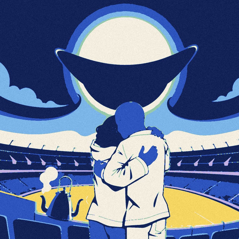 Two players in white shirts embrace beneath a giant eclipse while a third figure in a padded jacket is hidden behind their shoulders, with a small steaming kettle nearby.