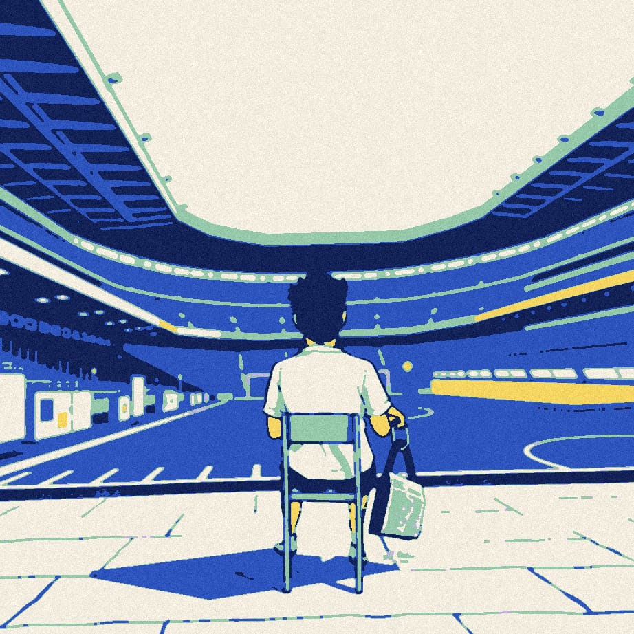 A supporter in a white shirt sits guarding a giant chained and padlocked tin outside a stadium at dusk.