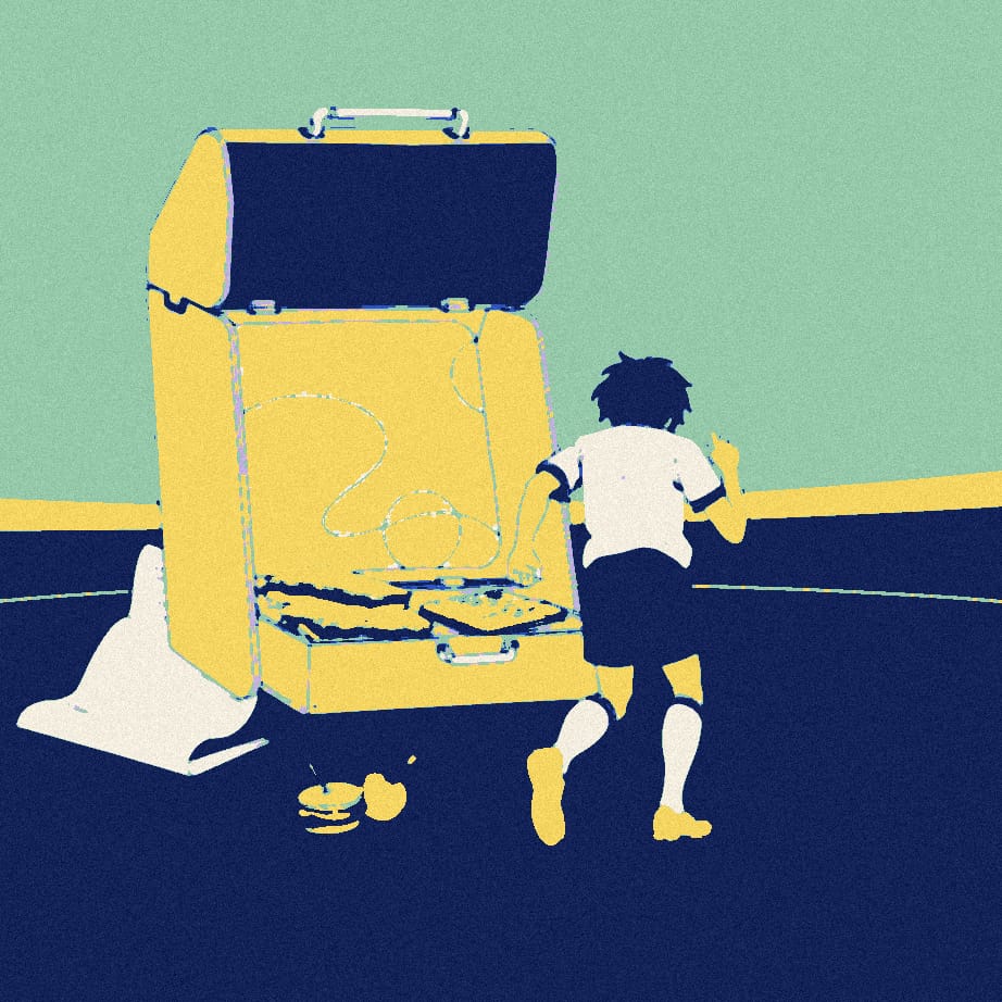 A tiny fan in a white shirt crouches eagerly on a pitch beside an enormous open lunchbox spilling sandwiches.