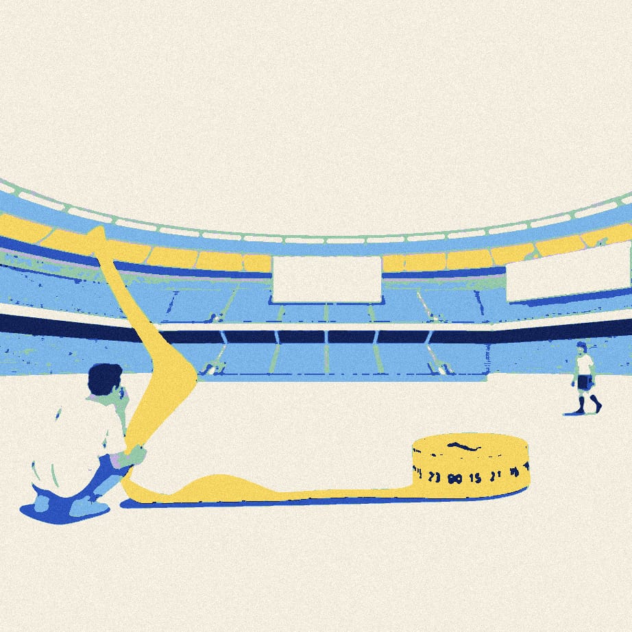 A tiny supporter stretches a huge tape measure across an empty forecourt towards a distant footballer in a white shirt.